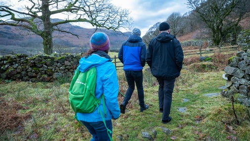 Visitors enjoying a brisk winter walk in Eskdale, Cumbria